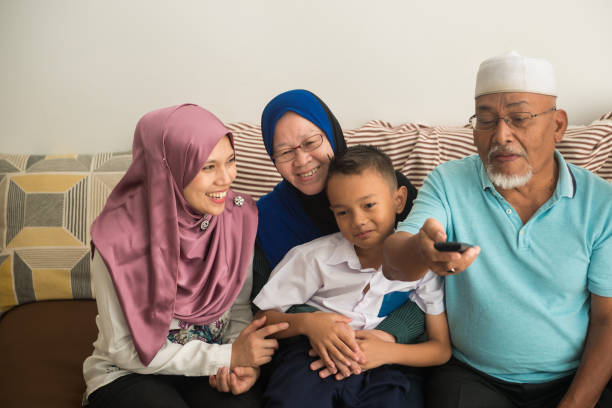 istock Modern multigenerational family realxing at home 959147562