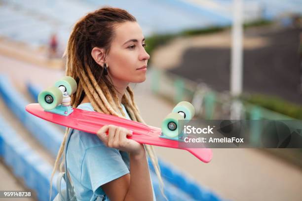Young Woman With Skateboard In The Stadium Stock Photo - Download Image Now - Adult, Beautiful People, Beauty