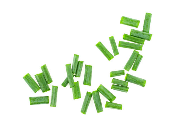 istock Chopped green onions on white background, top view. 959149410