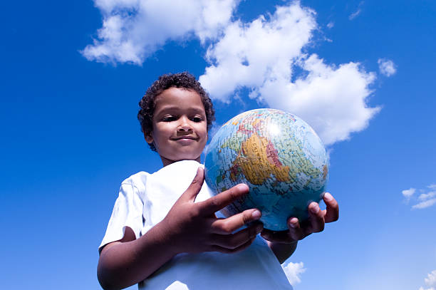 istock Cosmopolitan child holds the world in his hands 95915214