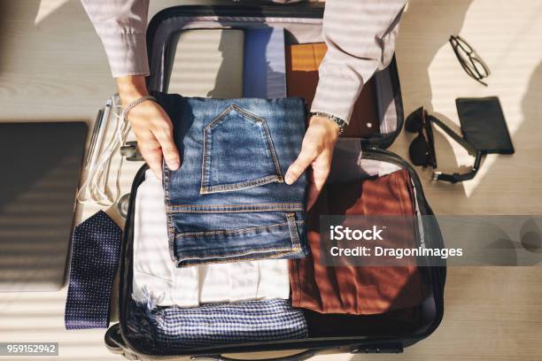 Packed Clothes Stock Photo - Download Image Now - Packing, Suitcase, Men