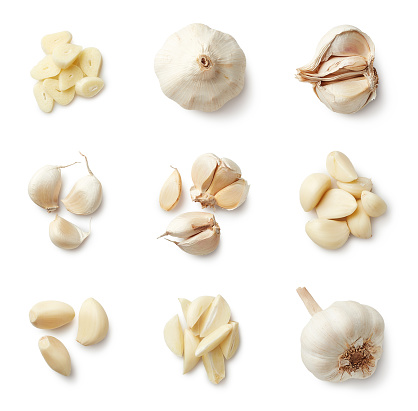 Set of fresh whole and sliced garlics