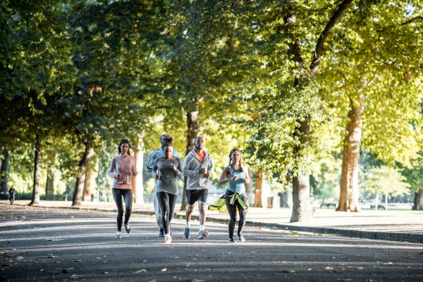istock Friends running in the park 959161648