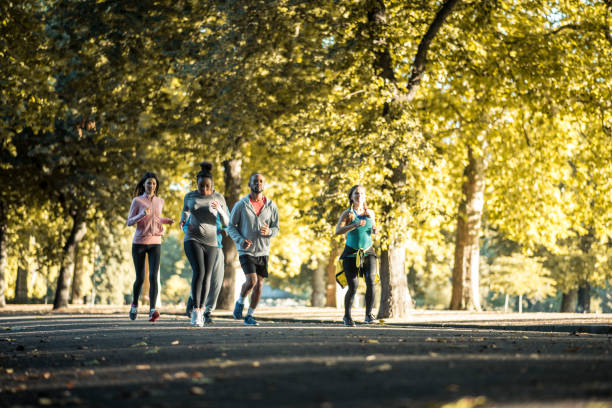 istock Friends running in the park 959161656
