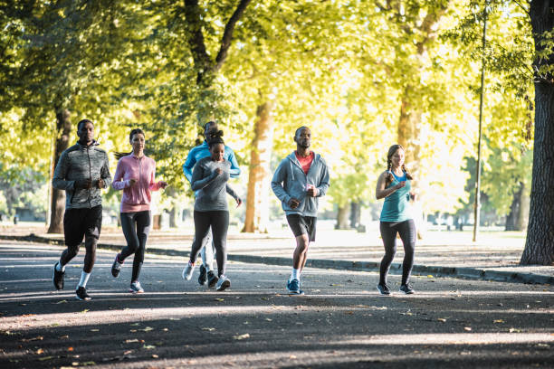istock Group of people running in the park 959161660