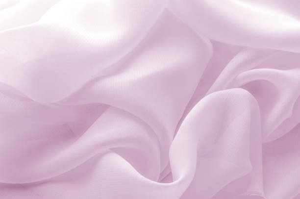 istock Texture, background, pattern. Silk fabric pale pink, abstract folds 959162058