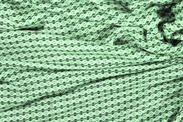 pano de algodão verde, com um padrão de círculos. retrô no design, este algodão estiramento geométrica verde-oliva sateen é perfeito para os anos 70! - lime green pleated pattern green - fotografias e filmes do acervo