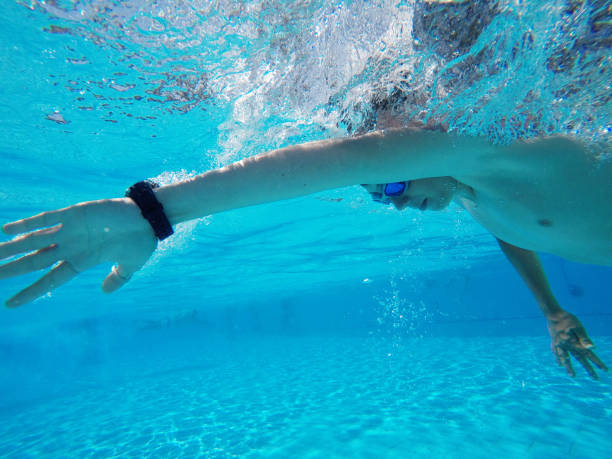 istock Child boy swimming pool water playing summer vacation fun 959162354