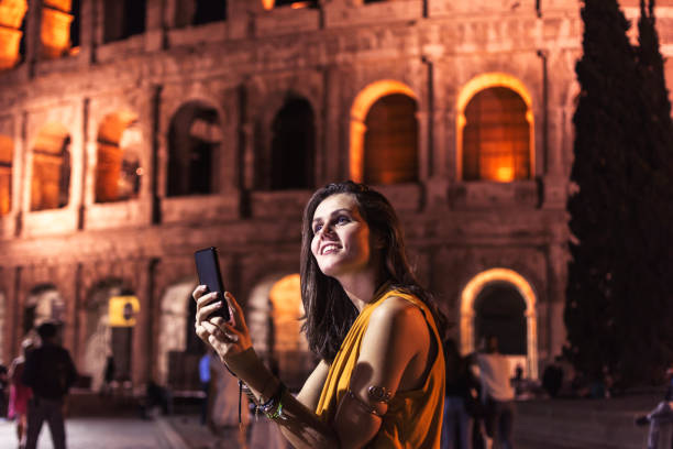 istock Smiling girl with phone 959166996