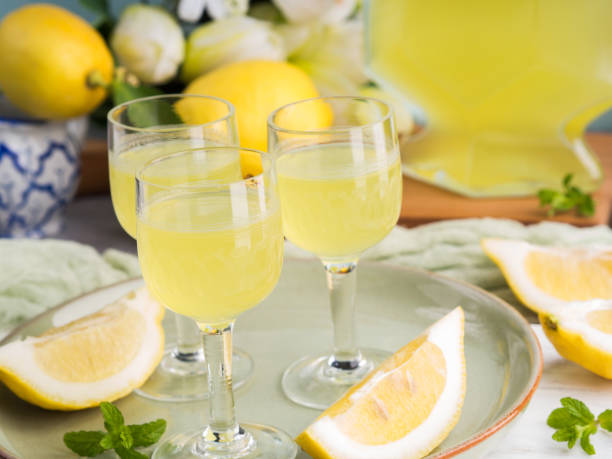 istock Home made limoncello in stemmed glasses 959169566