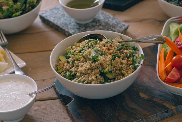 istock Green salad with vegetables on the wood table 959169874