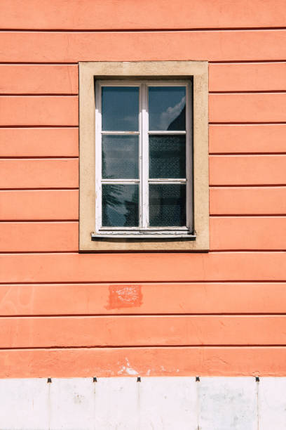 istock Window on Orange and White Striped Wall 959171270