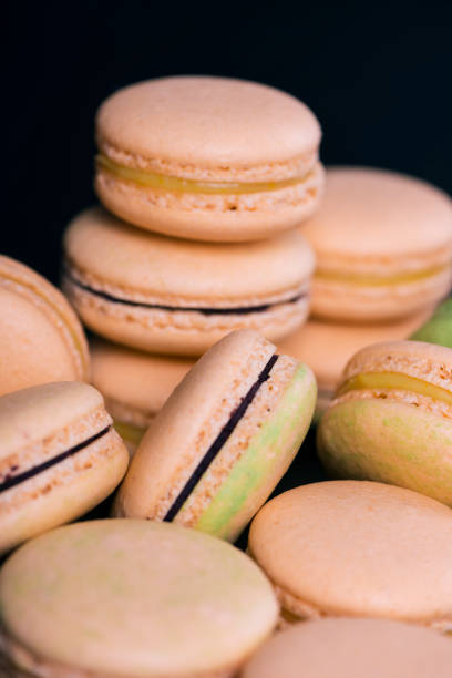 istock Many colored sweet macaroons cookie. Can be used as a background. Selective focus 959172156