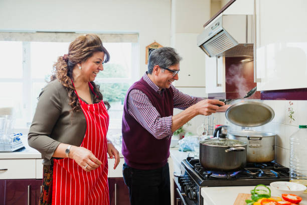 istock Happy Couple Cooking at Home 959173230