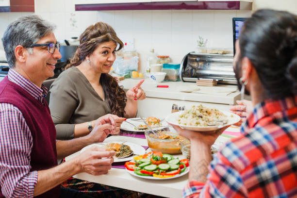 istock Family Enjoying Dinner Together 959173456