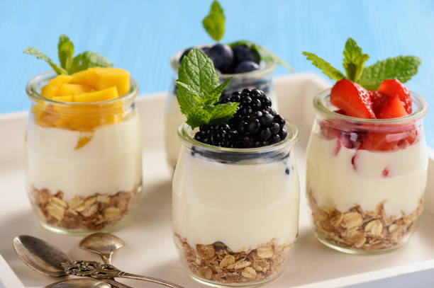 istock Natural yogurt with muesli, mango and berries. 959176010