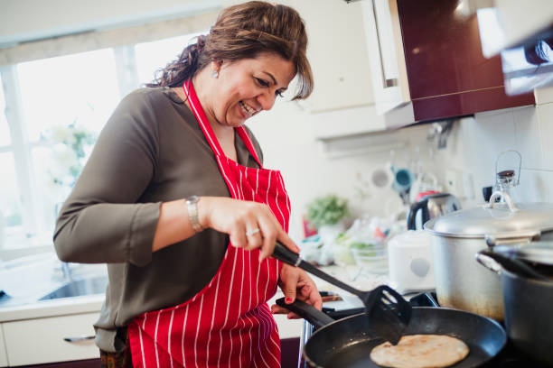 istock Mature Woman Making Chapati at Home 959176452