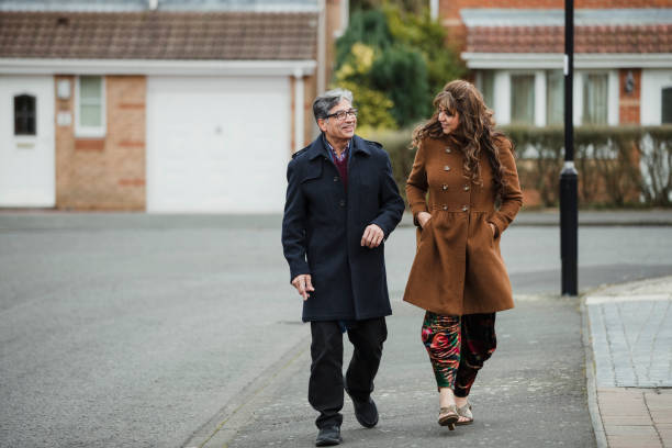 istock Mature Couple Walking Together 959176546