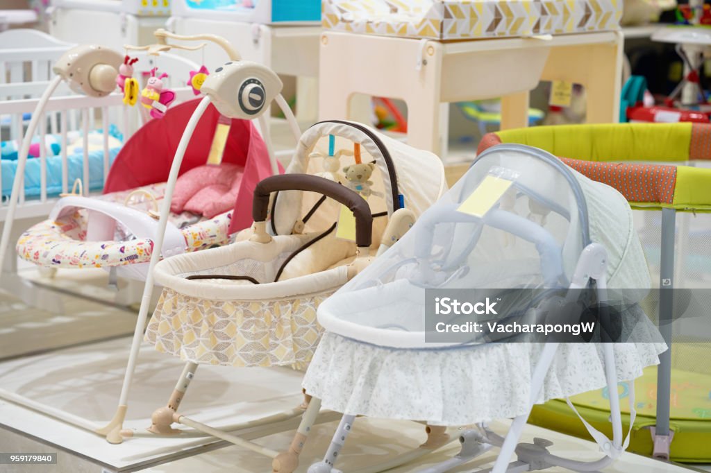 Baby crib or cot with cover in shop for sell Crib Stock Photo