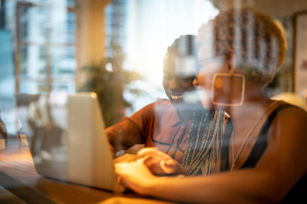istock Two Business woman meeting through window 959180342