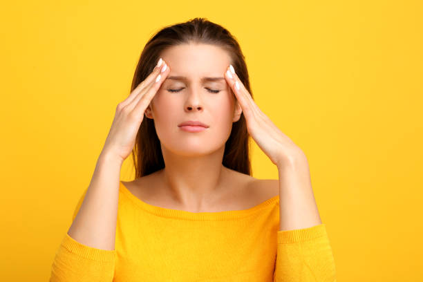 istock Woman against yellow wall background 959181050