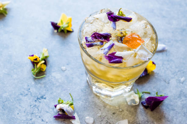 istock Herbal Iced Tea Cocktail with Edible Flowers and Crushed Ice. 959184098