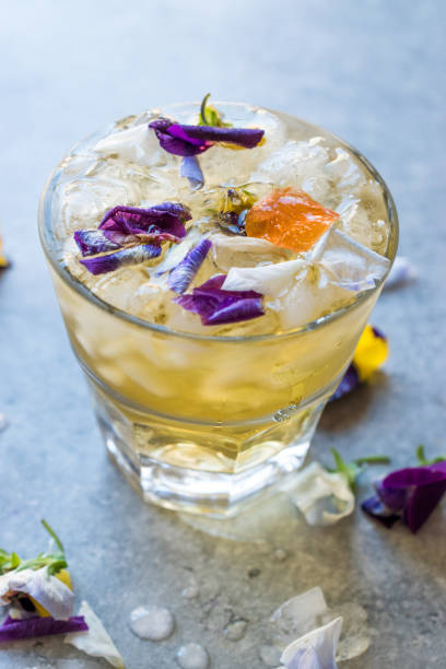 istock Herbal Iced Tea Cocktail with Edible Flowers and Crushed Ice. 959184292