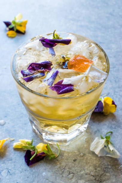 istock Herbal Iced Tea Cocktail with Edible Flowers and Crushed Ice. 959184630