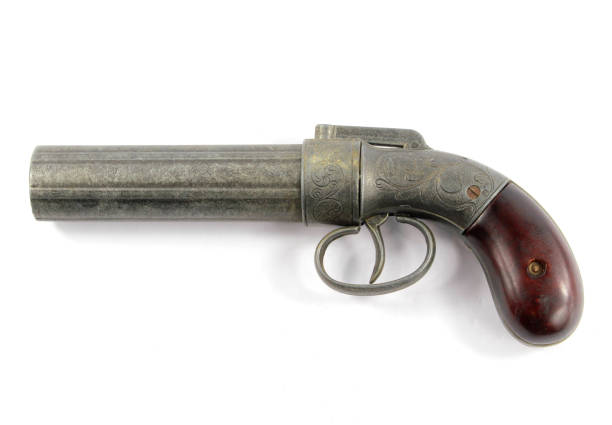 istock Antique Pistol Gun Revolver On White Background 959184904