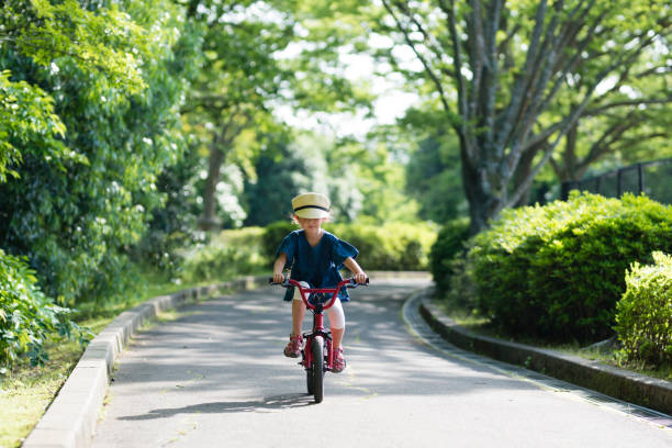 istock Girl playing on a bicycle 959186460