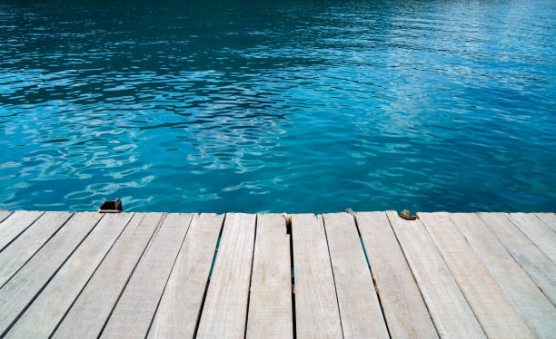 istock empty wood desk and summer blue sea background .Blank space for text and images 959192992