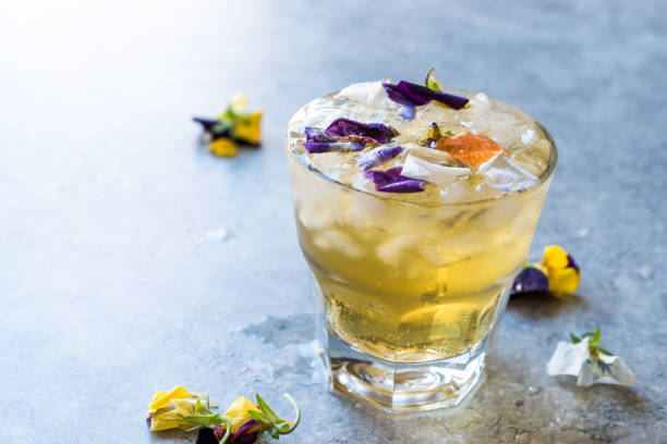 istock Herbal Iced Tea Cocktail with Edible Flowers and Crushed Ice. 959193370