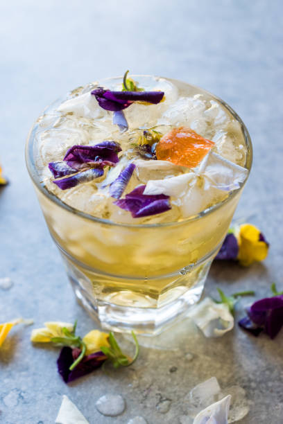 istock Herbal Iced Tea Cocktail with Edible Flowers and Crushed Ice. 959193518