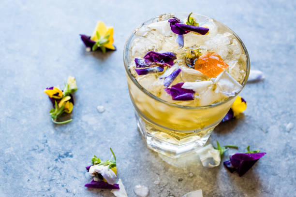 istock Herbal Iced Tea Cocktail with Edible Flowers and Crushed Ice. 959193752