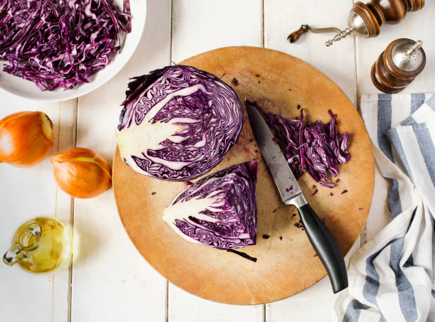 istock Shredded red cabbage on wooden cutting board 959193852