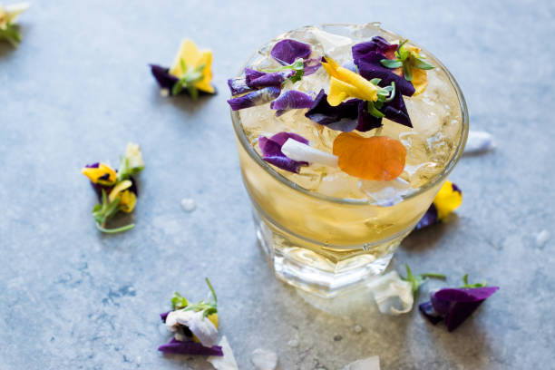 istock Herbal Iced Tea Cocktail with Edible Flowers and Crushed Ice. 959193944