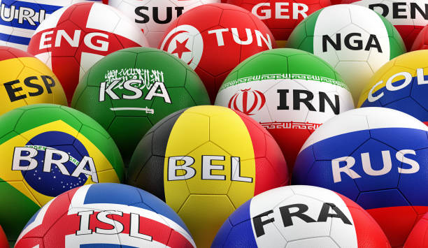 istock soccer balls colored in different national flag colors - 3D rendering 959199940