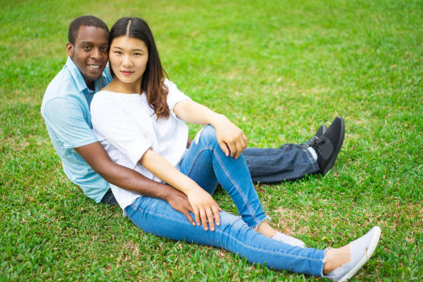 istock Beautiful young multiethnic couple embracing 959210436