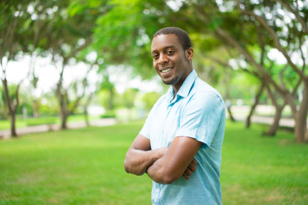 istock Jolly confident handsome African-American guy crossing arms 959210454