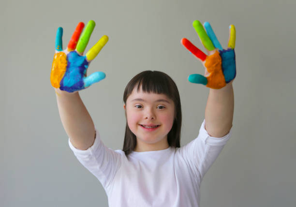 istock Cute little girl with painted hands. 959212674
