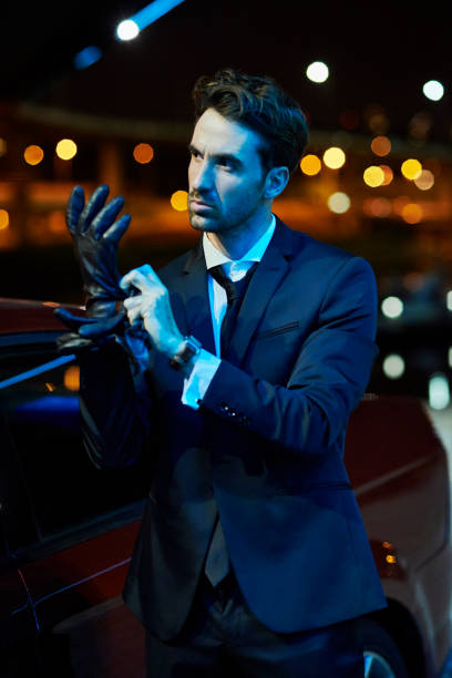 istock well dressed man putting on his gloves outdoors 959216342