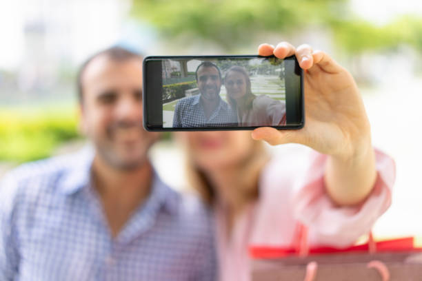istock Positive couple having fun after shopping 959217258