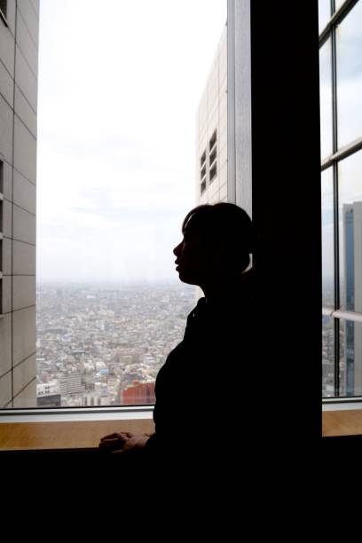 istock Young woman enjoying cityscape 959223164