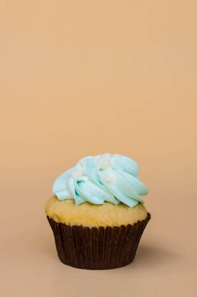 istock sweet cup cake dessert on yellow background and copy space 959224710