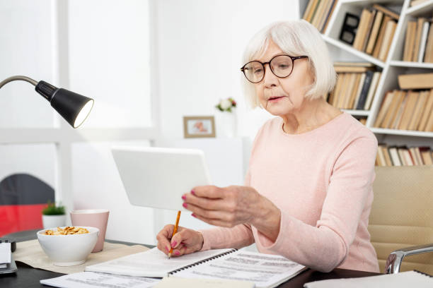 istock Pleasant senior woman recording lecture 959227308