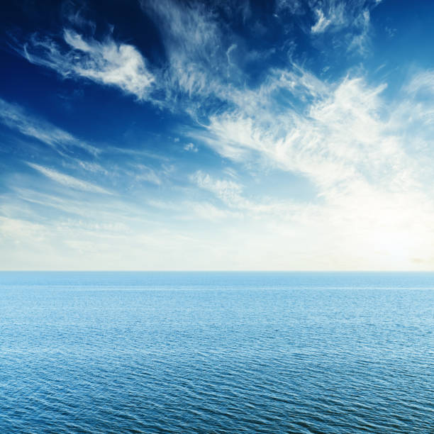 istock blue sea, clouds in sky and sunset 959229496