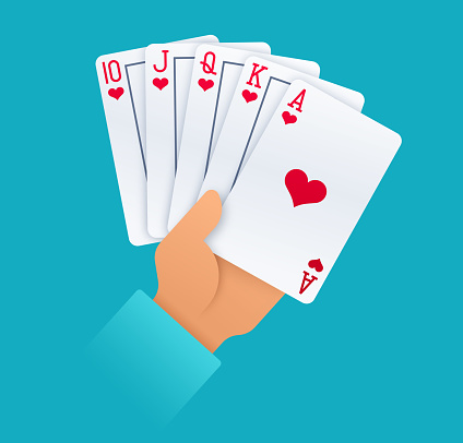 A person holding a royal flush poker gambling playing cards.