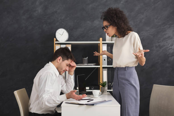 istock Couple of young colleagues arguing at office 959241802