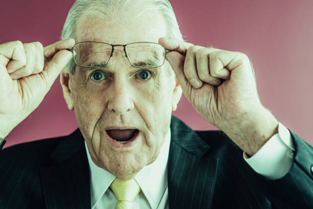 istock Surprised Senior Business Man Raising Glasses 959243420