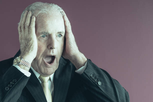 istock Stressed Senior Business Man Clutching Head 959243422